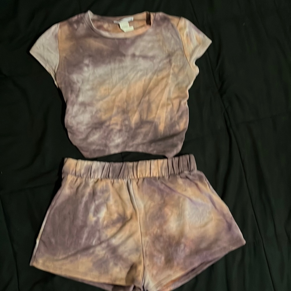 Two piece shorts set. Backless crop top with high waist shorts.